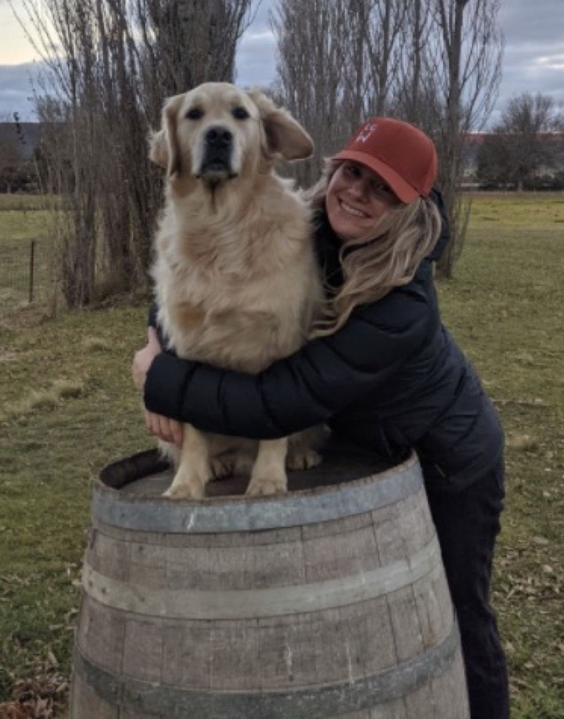 PAWS volunteers and dogs gathered at a community hall event