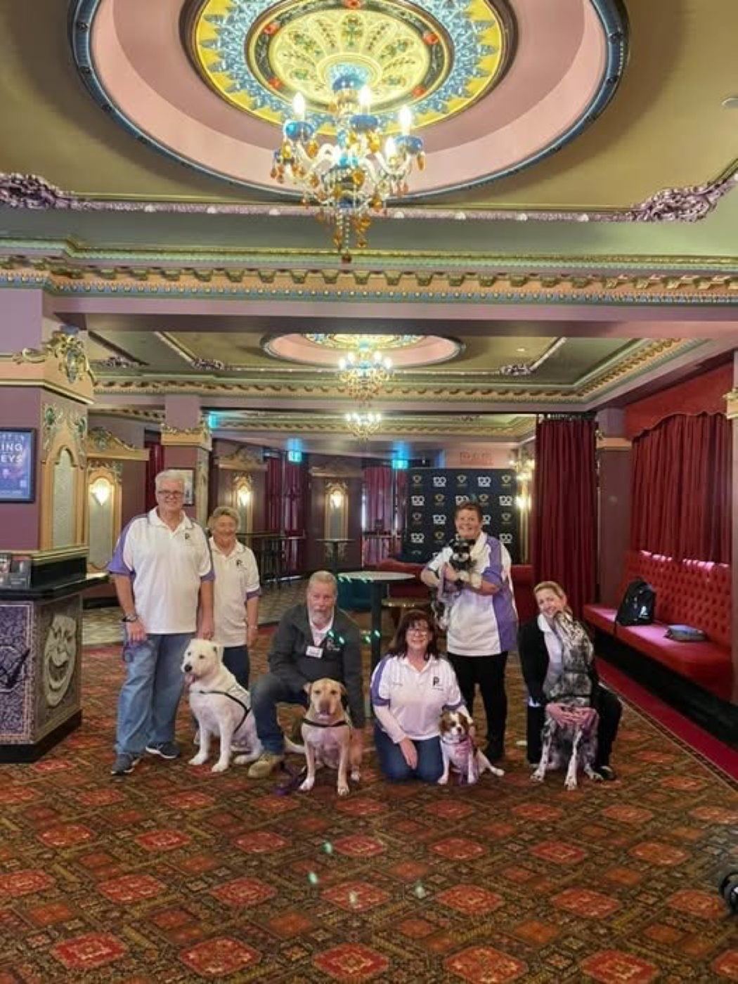 PAWS teams gathered in a grand hall